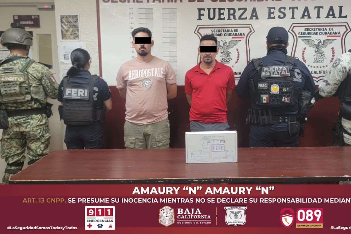 Sujetos originarios de Cuba detenidos con arma de fuego en plaza comercial