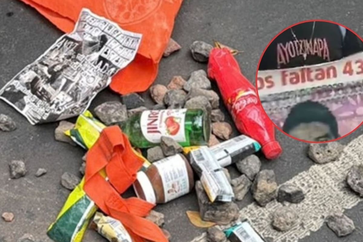 Arrojan piedras a policías de la CDMX durante marcha de Ayotzinapa