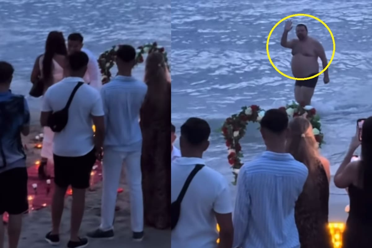 Hombre interrumpe la foto de boda de una pareja en la playa saliendo del mar en traje de baño