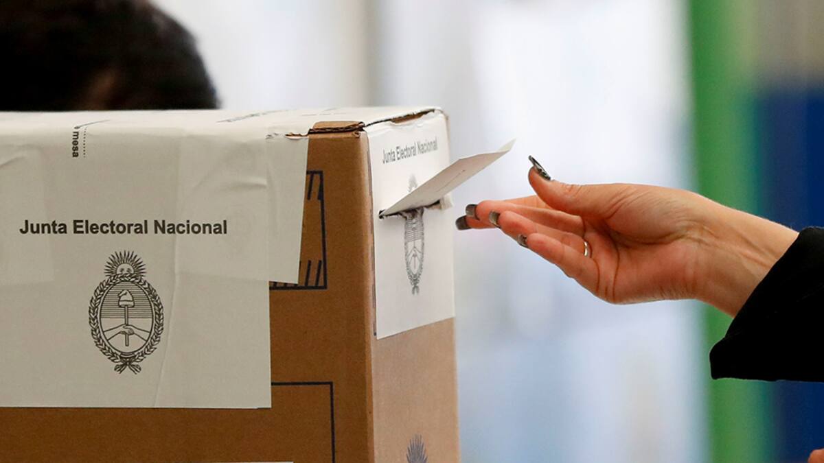 A woman casts her vote in a polling station during primary legislative elections, in Buenos Aires, Argentina September 12, 2021. REUTERS/Agustin Marcarian