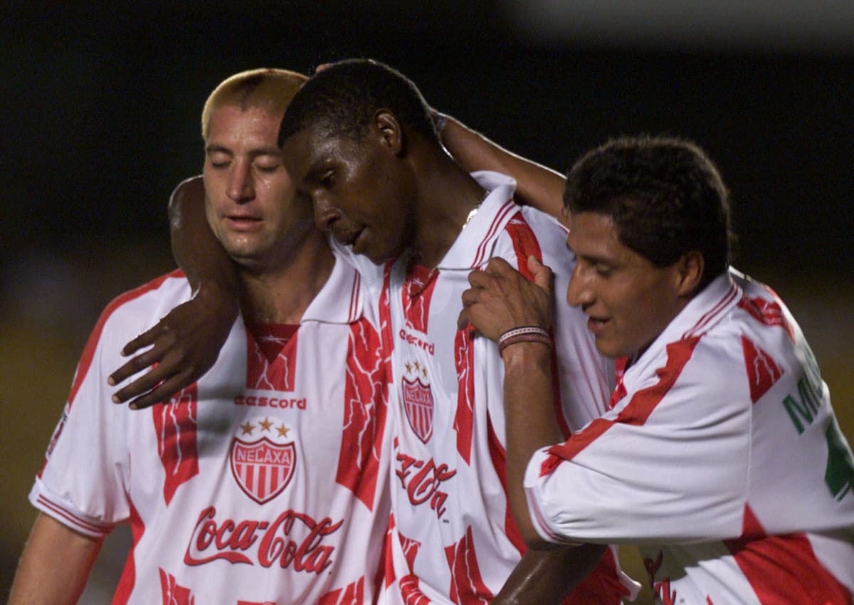 Members of Mexico's Necaxa congratulate Agustin Delgado, center, after his goal against of Australia's South Melbourne during a game of the First FIFA World Club Championship at the Maracana stadium in Rio de Janeiro, Brazil Saturday Jan. 8, 2000. (AP Photo/Dario Lopez-Mills)