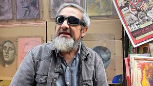 Arístides Alemán, el dibujante que da vida a retratos en el Pasaje Rodríguez.