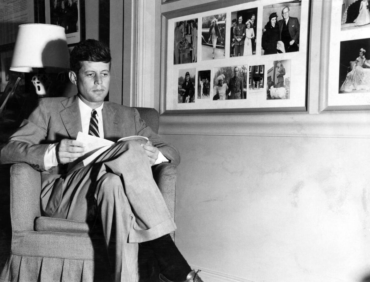 PX70-20:183 undated
John F. Kennedy reads at the Kennedy family home (Ambassador's residence) in Hyannis Port, MA.
Please credit "New Bedford Standard Times/John F. Kennedy Presidential Library and Museum, Boston"