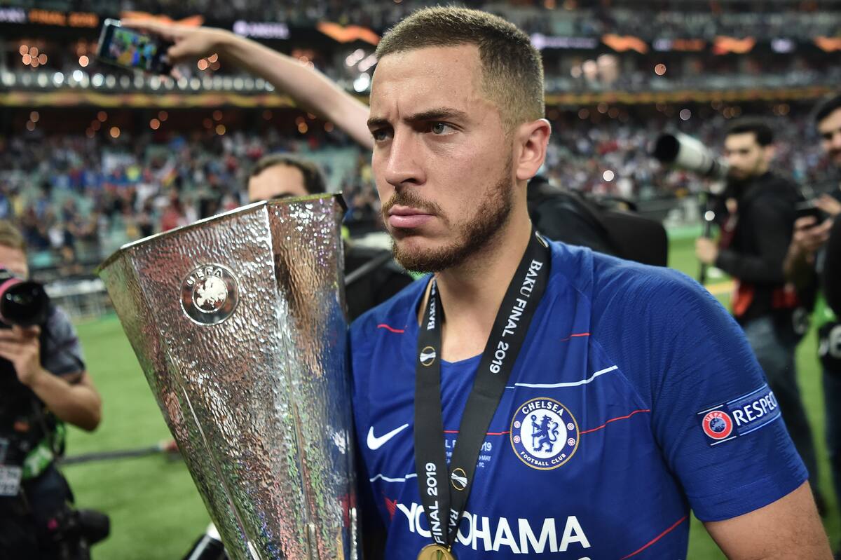 Chelsea's Belgian midfielder Eden Hazard holds the trophy after winning the UEFA Europa League final football match between Chelsea FC and Arsenal FC at the Baku Olympic Stadium in Baku, Azerbaijian, on May 29, 2019. (Photo by OZAN KOSE / AFP)