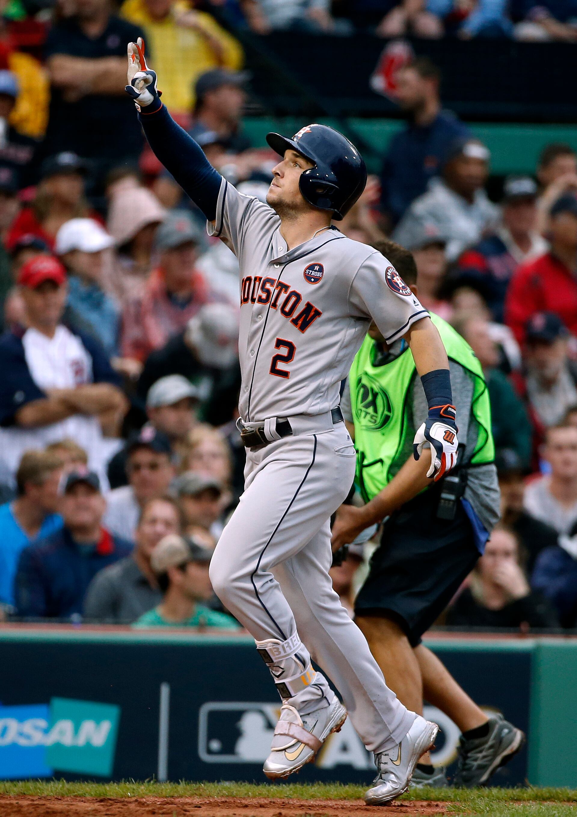 Houston Astros' Alex Bregman celebrates at the plate after hitting a home run off Boston Red Sox relief pitcher Chris Sale, right, during the eighth inning of Game 4 in baseball's American League Division Series, Monday, Oct. 9, 2017, in Boston. (AP Photo/Michael Dwyer)