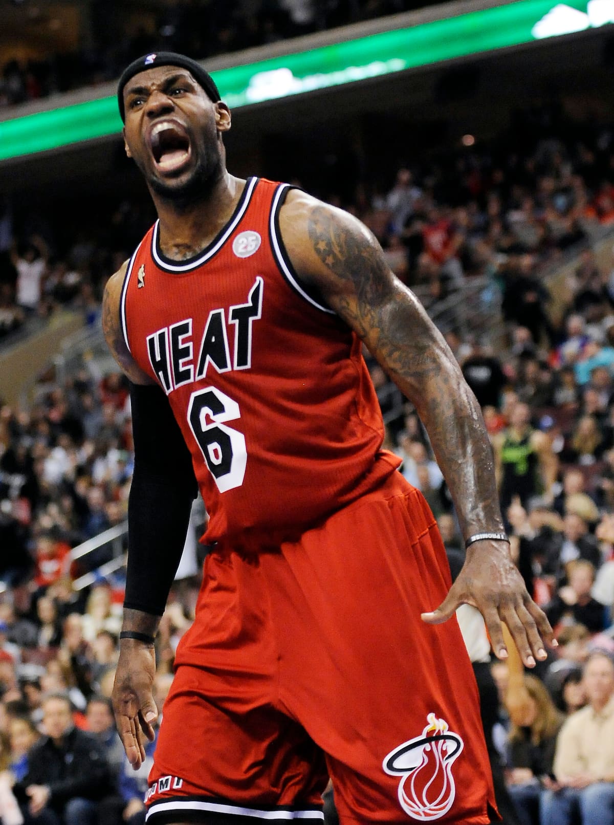 Miami Heat's LeBron James (6) reacts after he scores on a dunk during the second half of an NBA basketball game against the Philadelphia 76ers, Saturday, Feb. 23, 2013, in Philadelphia. The Heat won, 114-90. (AP Photo/Michael Perez)