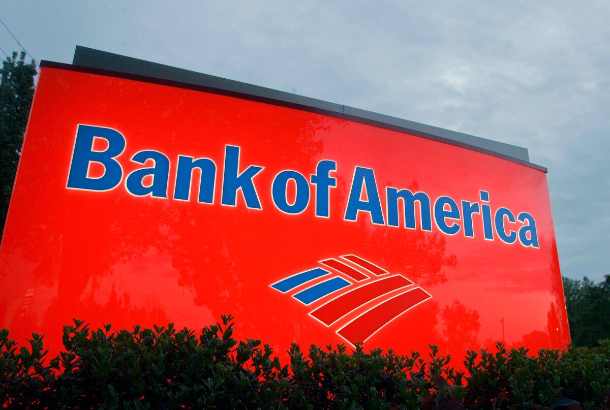 FILE - In this April 21, 2008 file photo, a sign for a Bank of America branch is shown in Charlotte, N.C. Bank of America says it will no longer process transactions for the website WikiLeaks, following similar actions by several other financial institutions. (AP Photo/Chuck Burton, File)