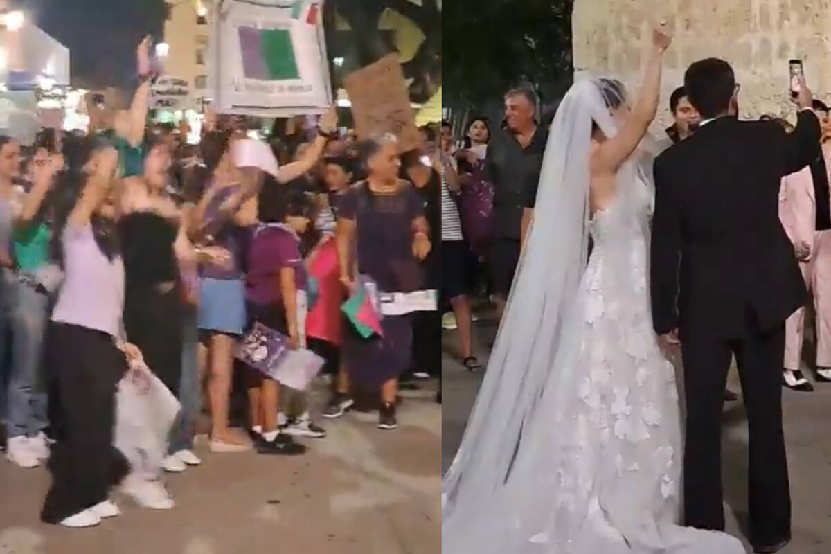 Mujeres pausan su marcha del 8M para celebrar a pareja en su boda fuera de una iglesia de Mérida