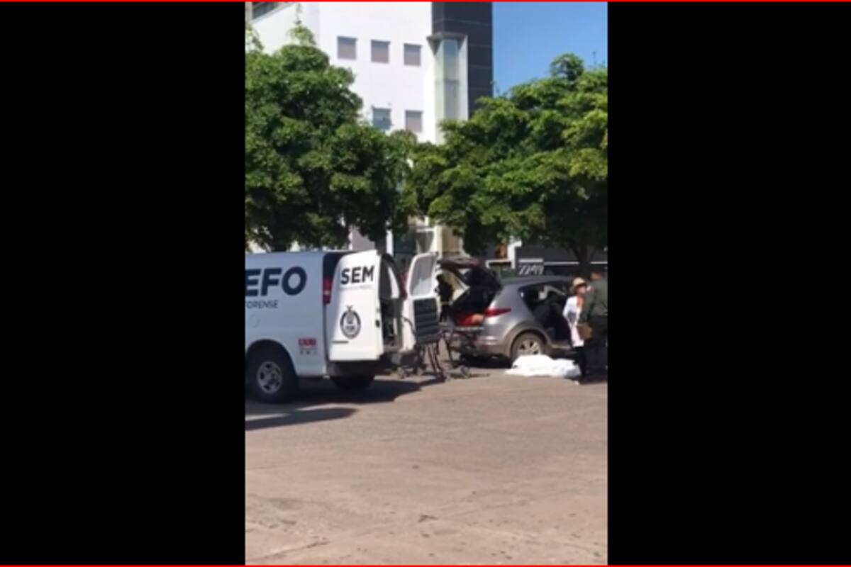 Mujer llora desconsolada tras hallazgo de cuerpo encajuelado luego de balaceras en Culiacán