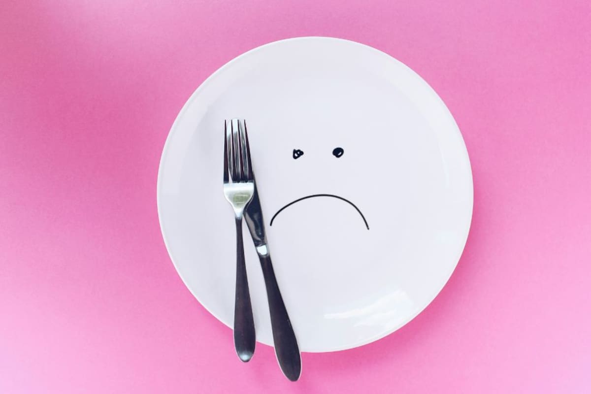 Dile adiós al ‘mal del puerco’: 5 trucos para comer de todo en Navidad sin inflamarte