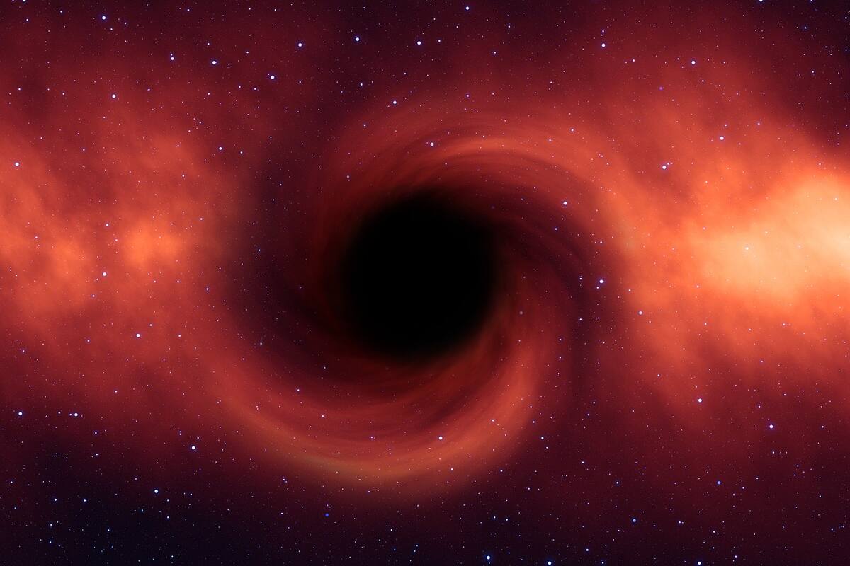 Astrónomos descubren dos agujeros negros en una espiral de muerte