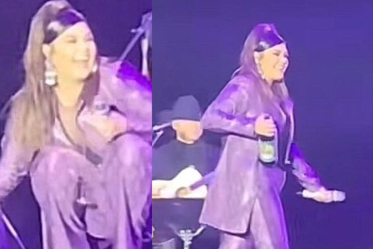 Yuridia le acepta una caguama a admirador en pleno concierto
