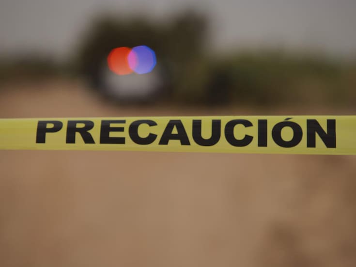 Localizan cuerpo con huellas de violencia en predio baldío