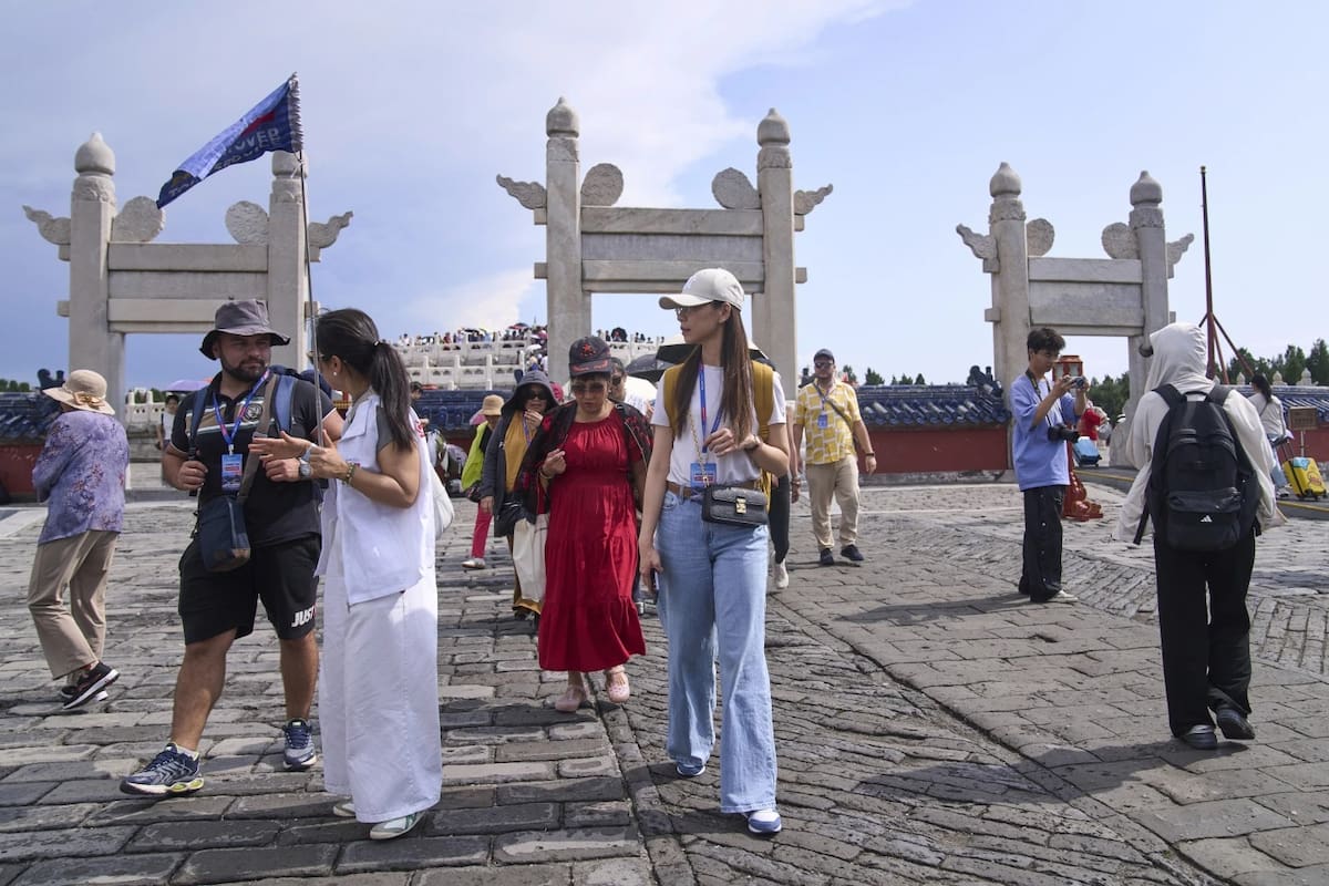 China elimina trámites para impulsar el turismo y viajeros llegan con facilidad al país. | Crédito: AP