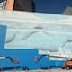 Una demanda de 25 millones de dólares enfrenta a un artista con la FIFA después de que su mural de ballenas, pintado en 1999 y convertido en símbolo de Dallas, fuera cubierto de azul antes del Mundial