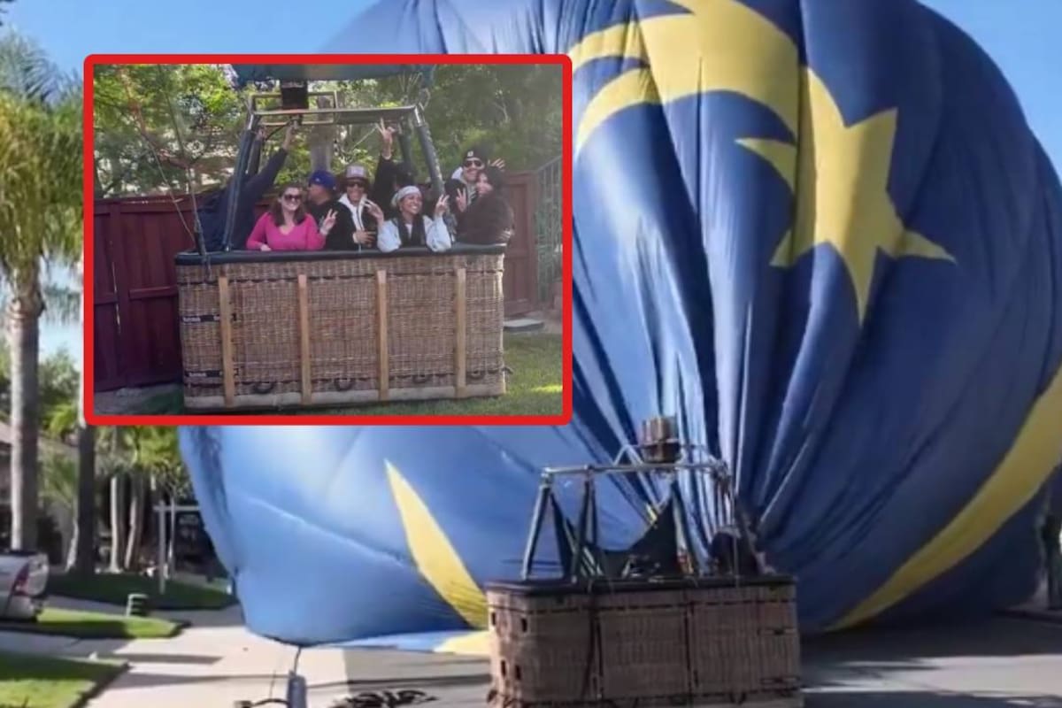 Su esposa estaba haciendo yoga y él viendo televisión cuando un globo aerostático aterrizó en el patio de su casa con 13 personas a bordo; reportaron que no hubo lesionados
