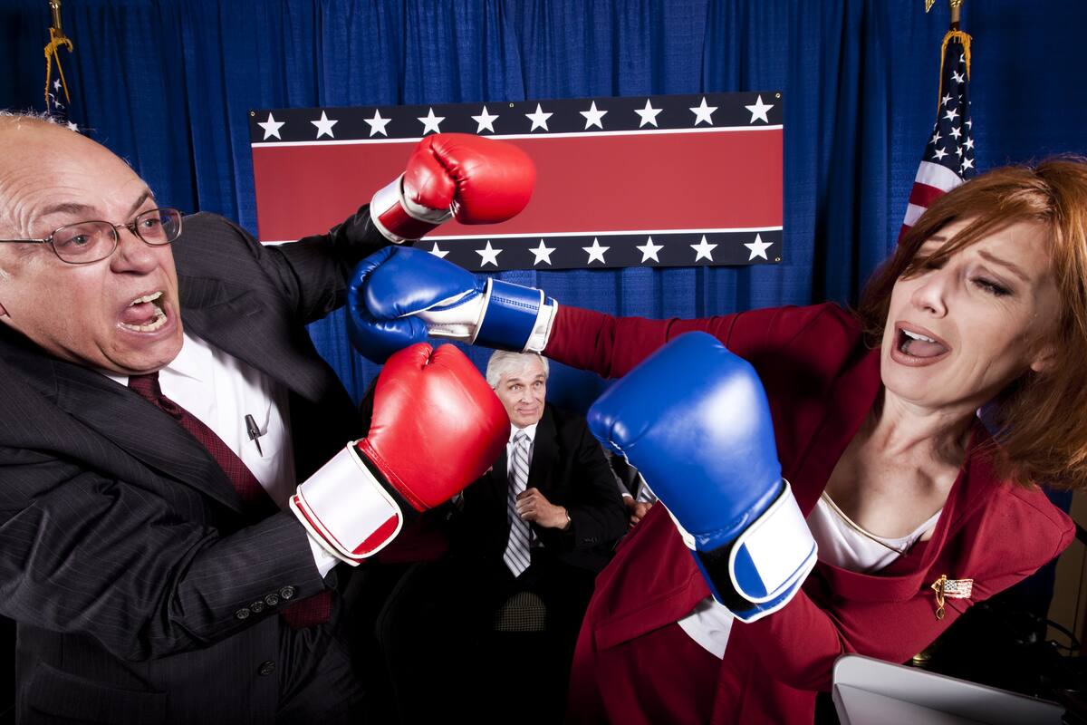Two mature politicians (one male, one female) engage in a heated debate which turns into a conflict and then escalates into a full-blown boxing match.
