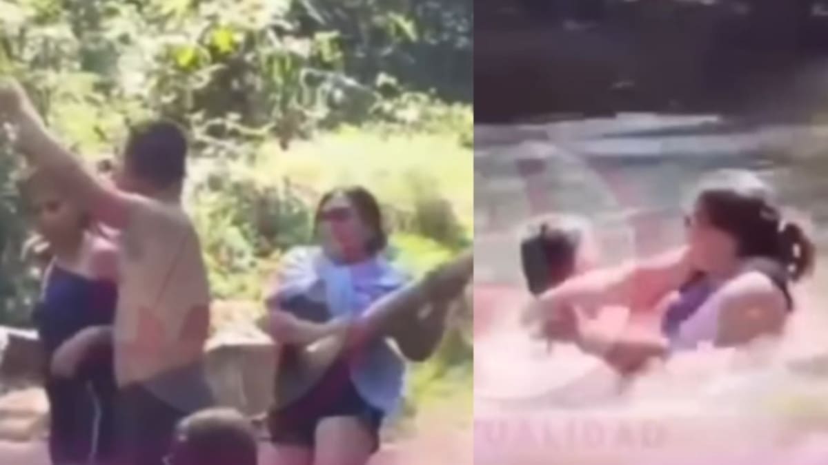 Mujer sorprende infidelidad, usa un palo y arroja a su pareja y a la amante a una cascada