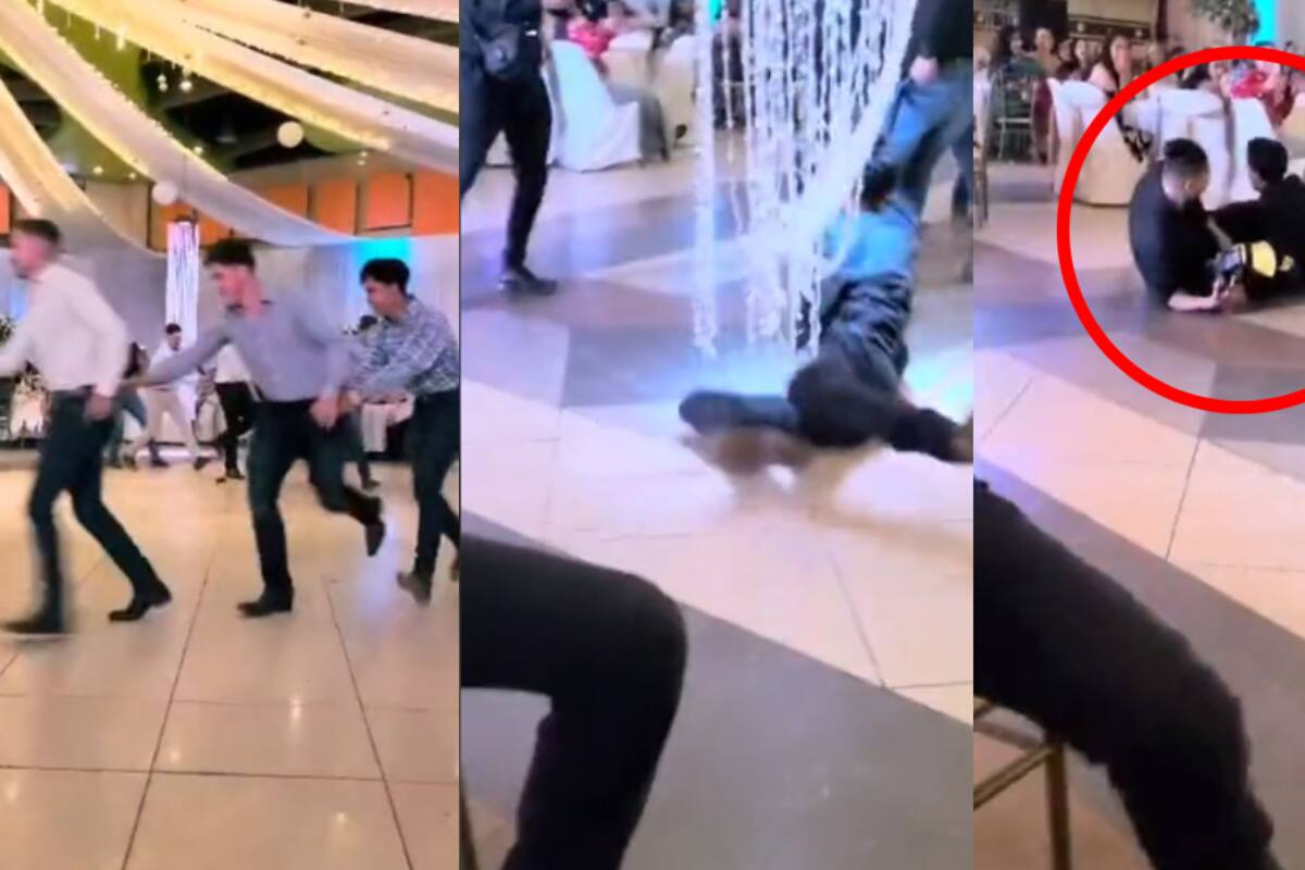 VIDEO | En una boda, este joven es arrastrado por el suelo en un popular baile: ¡termina tirando a un fotógrafo!