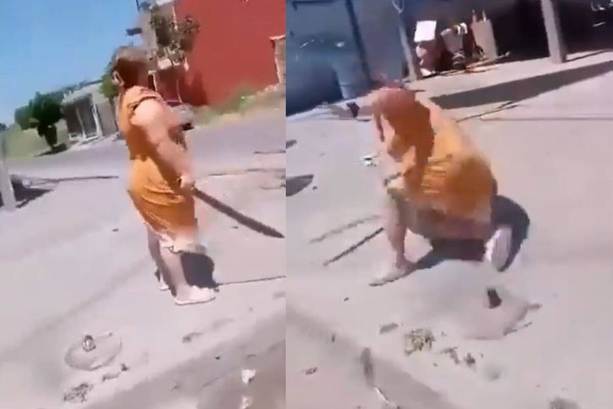 VIDEO: Mujer enfurecida se enfrenta a empleados de CFE con machete y se rompe un brazo