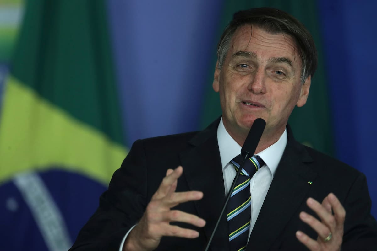 Brazil's President Jair Bolsonaro speaks during an event at the Planalto Presidential Palace, in Brasilia, Brazil, Tuesday, April 30, 2019. Bolsonaro convened a meeting of top ministers to discuss the ongoing situation in Venezuela. (AP Photo/Eraldo Peres)