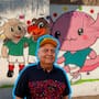 Hermosillo también se pinta mundialista: Pintor de la tercera edad rescata barda grafiteada y crea un mural en homenaje a las mascotas de Copas del Mundo