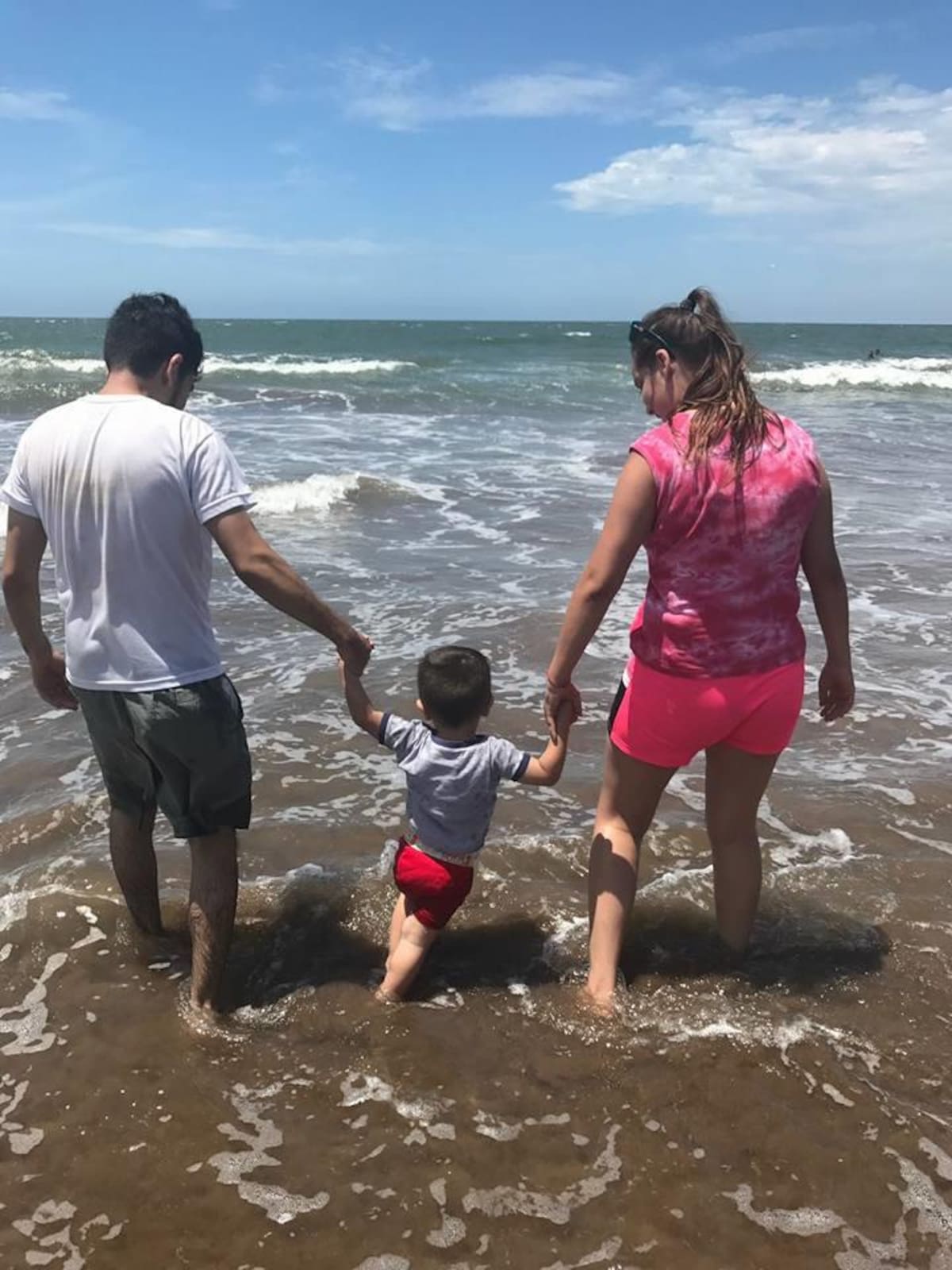 En familia se disfruta de esta tranquila playa.