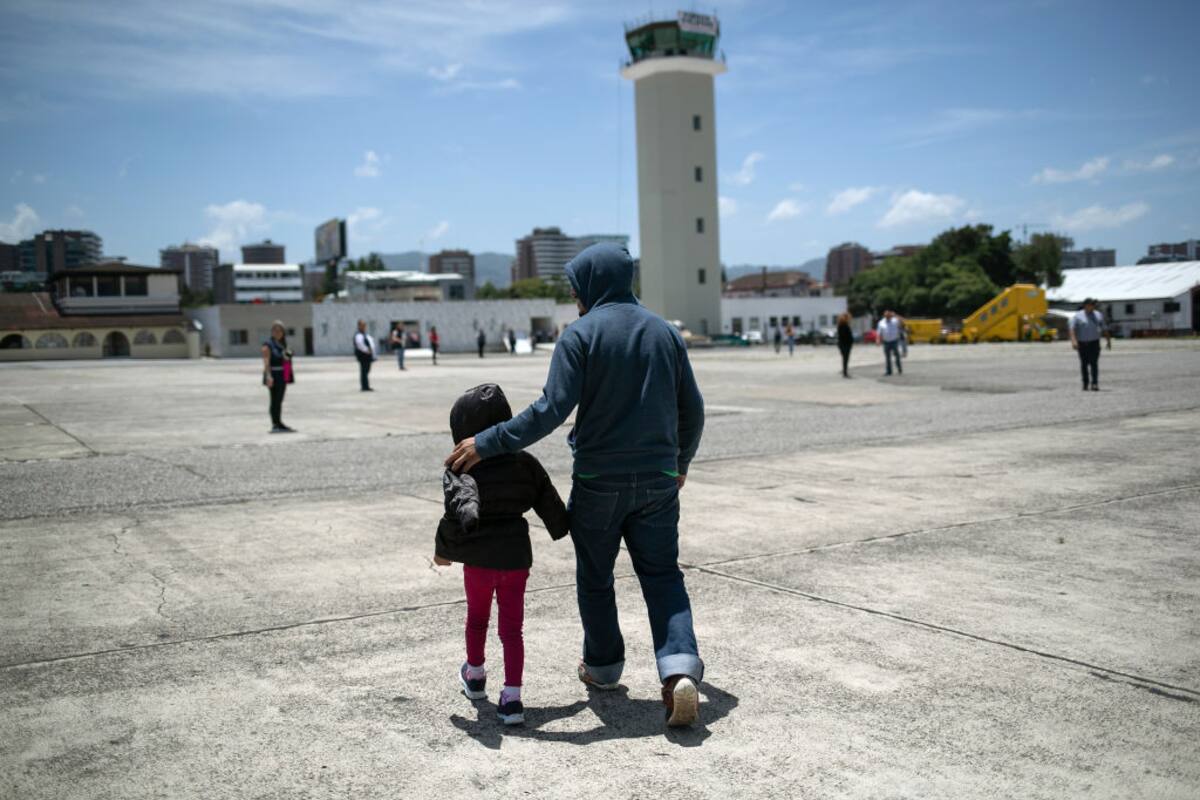 GUATEMALA CITY, GUATEMALA - AUGUST 29: A father and daughter arrive on an ICE deportation flight from Brownsville, Texas on August 29, 2019 to Guatemala City. Under a new policy, ICE has expedited removal procedures for many Guatemalan families and adults arriving to the U.S.-Mexico border. (Photo by John Moore/Getty Images)