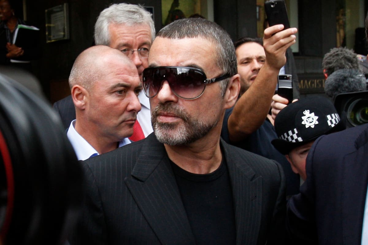 FILE - In this Aug. 24, 2010, file photo, British singer George Michael leaves Highbury Corner Magistrates Court in north London. Michael pleaded guilty in a London court to two drug offenses. He admitted driving under the influence of drugs and possession of cannabis following an incident on July 4 when his car crashed into a shop in north London. Michael, who rocketed to stardom with WHAM! and went on to enjoy a long and celebrated solo career lined with controversies, has died, his publicist said Sunday, Dec. 25, 2016. He was 53. (AP Photo/Sang Tan, File)