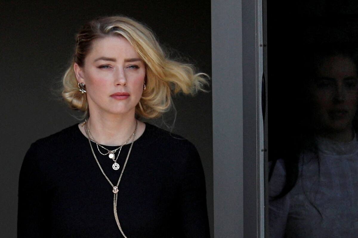 IMAGEN DE ARCHIVO. Amber Heard abandona el juzgado de circuito del condado de Fairfax después de que el jurado anunciara veredictos divididos en el juicio por difamación civil Depp v. Heard en el juzgado de circuito del condado de Fairfax, en Fairfax, Virginia, EEUU, Junio 1, 2022. REUTERS/Tom Brenner