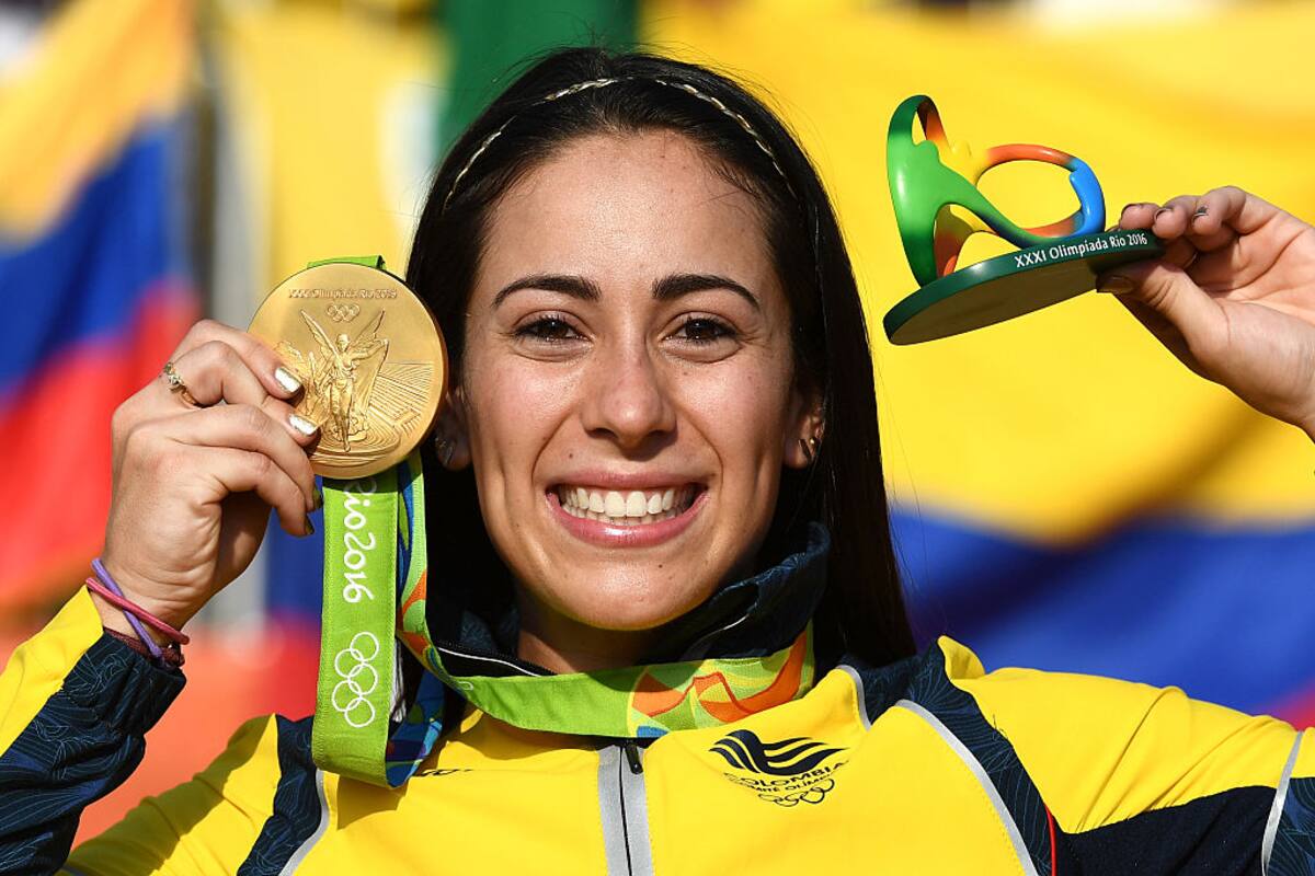 RIO DE JANEIRO, BRAZIL - AUGUST 19: Mariana Pajon of Colombia celebrates with the gold after winning the Women's BMX Final on day 14 of the Rio 2016 Olympic Games at the Olympic BMX Centre on August 19, 2016 in Rio de Janeiro, Brazil. (Photo by David Ramos/Getty Images)