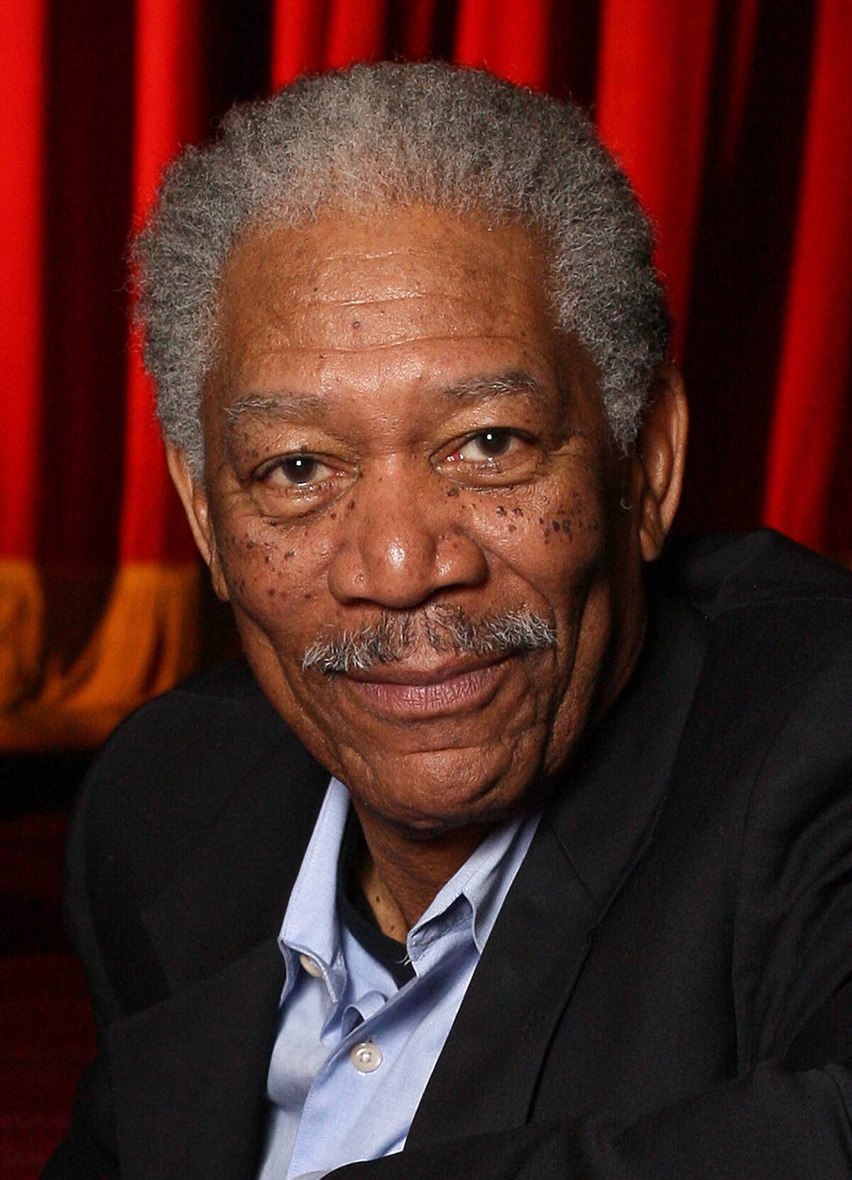 ** FILE ** In this April 25, 2008 file photo, actor Morgan Freeman poses in the Jacobs Theater in New York. (AP Photo/Rick Maiman, file)