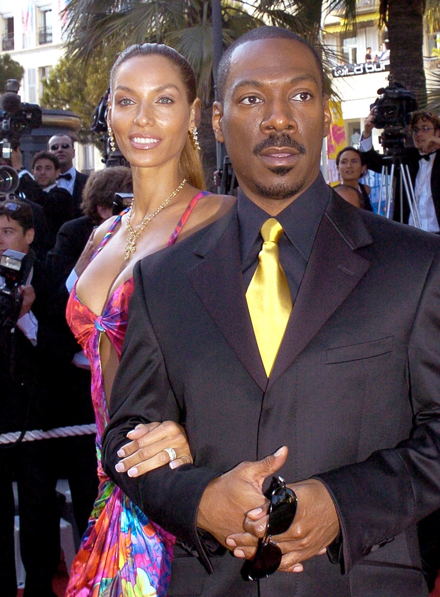  American actor Eddie Murphy, right, and his wife Nicole Murphy, left,  pose as they arrive for the screening of the animated film"Shrek 2,"in competition, directed by New Zealander Andrew Adamson, American Kelly Asbury and American Conrad Vernon, at the 57th International Film Festival in Cannes, southern France, Saturday, May 15, 2004. (AP Photo/Patrick Gardin)